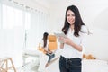 Beauty Asian woman using tablet for checking order from customers at home. Business and Delivery transportation concept. Logistic Royalty Free Stock Photo