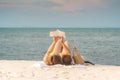 Beauty Attractive Asian woman wearing bikini reading book on the beach Royalty Free Stock Photo