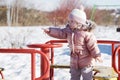 Beauty baby . Adorable girl having fun on a swing on beautiful autumn day . Portrait of cute girl playing in Royalty Free Stock Photo