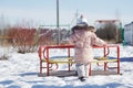 Beauty baby . Adorable girl having fun on a swing on beautiful autumn day . Portrait of cute girl playing in Royalty Free Stock Photo