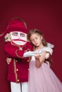 The beauty ballerina who holding a nutcracker Royalty Free Stock Photo