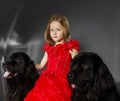 Beauty and the Beast. Girl with big black water-dog. Royalty Free Stock Photo