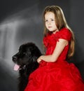 Beauty and the Beast. Girl with big black water-dog. Royalty Free Stock Photo