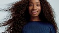 Beauty black mixed race african american woman with long curly hair and perfect smile Royalty Free Stock Photo