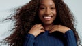 Beauty black mixed race african american woman with long curly hair and perfect smile Royalty Free Stock Photo