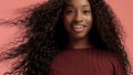 Beauty black mixed race african american woman with long curly hair and perfect smile Royalty Free Stock Photo