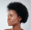 Beauty, black woman and natural hair in studio for cosmetic, treatment and routine on white background. Haircare, face