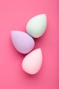 Beauty blender on pink background. Bright sponges for make-up cosmetics Royalty Free Stock Photo