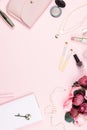 Beauty blog concept flat lay. Fashion accessories, flowers, cosmetics, jewelry on pink background. Royalty Free Stock Photo