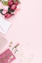 Beauty blog concept flat lay. Fashion accessories, flowers, cosmetics, jewelry on pink background. Royalty Free Stock Photo