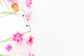 Beauty blog concept. Freelancer or blogger workspace with clipboard, notebook, pink tulips and accessories on white background. Fl Royalty Free Stock Photo