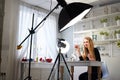 Beauty blogger woman filming daily make-up routine tutorial on camera. Influencer blonde girl live streaming cosmetics