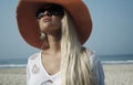 Beauty blond woman on the beach in the hat Royalty Free Stock Photo