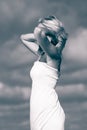 Beauty blonde woman portrait on sky background Royalty Free Stock Photo