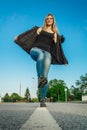 Beauty blonde young woman pose on street in jacket Royalty Free Stock Photo