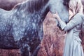 Beauty blondie with horse in the field, effect Royalty Free Stock Photo