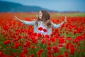 Beauty blue eyes teen enjoy summer days .Cute fancy dressed girl in poppy field. Field of blooming poppies Royalty Free Stock Photo