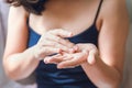 Beauty Body Skin Care and Cosmetic Apply Concept, Close-Up of Woman Hands is Applying Moisturizing Serum for Healthy Skin.