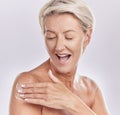 Beauty, bodycare and woman applying lotion for skincare routine applying lotion on her body. Studio portrait of a happy