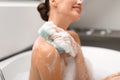Lady Washing Body Using Sponge Taking Bath Sitting In Bathroom Royalty Free Stock Photo