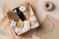 Beauty box with bottles of natural cosmetics, body brush, bamboo hair comb, loofah Royalty Free Stock Photo