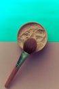 Beauty box, crumbly matte mineral powder with a special brown beautiful wooden brush from natural nap for makeup Royalty Free Stock Photo