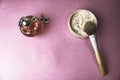 Beauty box, powder with a brown brush from nap for makeup, pink perfume and earrings on a background. Flat lay. Top view Royalty Free Stock Photo