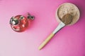 Beauty box, powder with a brown brush from nap for makeup, pink perfume and earrings on a background. Flat lay. Top view Royalty Free Stock Photo