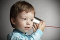 Boy listen tin can telephone Royalty Free Stock Photo