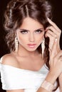 Beauty Bride. Beautiful elegant brunette girl, fashion model posing. Make up. Hairstyle. Jewelry. Studio Photo