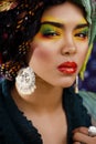 beauty bright woman with creative make up, many shawls on head like cubian, ethno look closeup Royalty Free Stock Photo