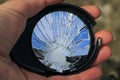 Beauty of the broken mirror in the small cracks in the hand Royalty Free Stock Photo
