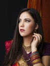 Beauty brunette Indian woman portrait. Hindu model girl with brown eyes. Indian girl in sari.