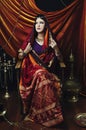 Beauty brunette Indian woman portrait. Hindu model girl with brown eyes. Indian girl in sari.