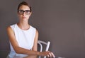 Beauty in business. Gorgeous woman in a white dress wearing glasses. Royalty Free Stock Photo