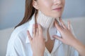 Close up of a young woman visiting beauty center and having taping procedure on her neck muscle