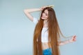 Beauty close-up portrait of beautiful young woman with long brown hair on white background. Hair care concept. Royalty Free Stock Photo
