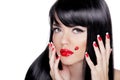 Beauty closeup portrait of brunette girl with professional makeup, red lips, polish manicure nails isolated on white background. Royalty Free Stock Photo