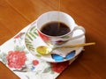 Beauty coffeecup standing on wooden table with dark tasty coffee Royalty Free Stock Photo