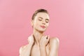 Beauty Concept - Beautiful Woman with Clean Fresh Skin close up on pink studio. Skin care face. Cosmetology. Royalty Free Stock Photo