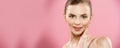 Beauty Concept - Beautiful Woman with Clean Fresh Skin close up on pink studio. Skin care face. Cosmetology. Royalty Free Stock Photo