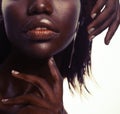 Beauty concept: Portrait of a sensual young African woman with colored make up Royalty Free Stock Photo