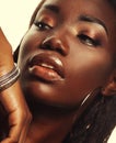 Beauty concept: Portrait of a sensual young African woman with colored make up Royalty Free Stock Photo