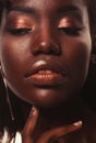 Beauty concept: Portrait of a sensual young African woman with colored make up Royalty Free Stock Photo