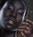 Beauty concept: Portrait of a sensual young African woman with colored make up Royalty Free Stock Photo