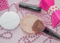 Beauty corner powder and brush for powder and lipstick and perfume in the shape of a bow