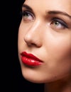 Beauty, cosmetic and makeup on closeup, female person and lipstick on studio background. Mascara, glamour and skincare