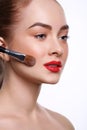 Beauty, cosmetics, finish make-up, powder brush Royalty Free Stock Photo