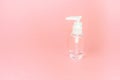 Beauty cosmetics glassbottle; branding mock up; front view on pastel pink background. Royalty Free Stock Photo