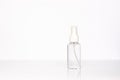 Beauty cosmetics glassbottle; branding mock up; front view on pastel white background. Royalty Free Stock Photo